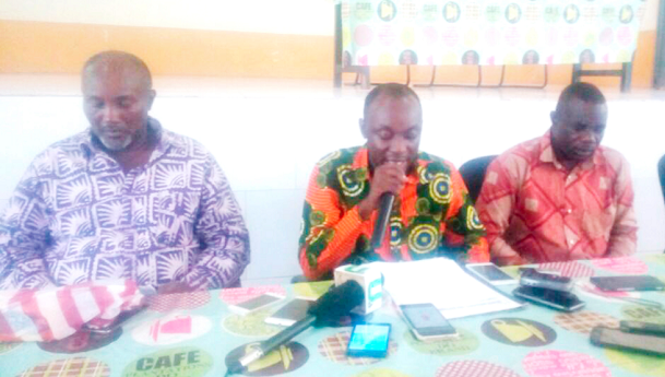 Mr Agyeman (middle) addressing the press conference